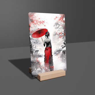 Akrylové sklo zasnežená krajina so ženou držiacou dáždnik