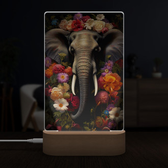 Lampa slon obklopený kvetmi a listami