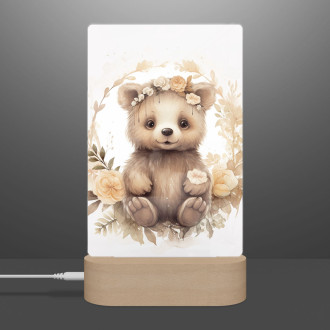 Lampa Mláďa grizzlyho v kvetoch